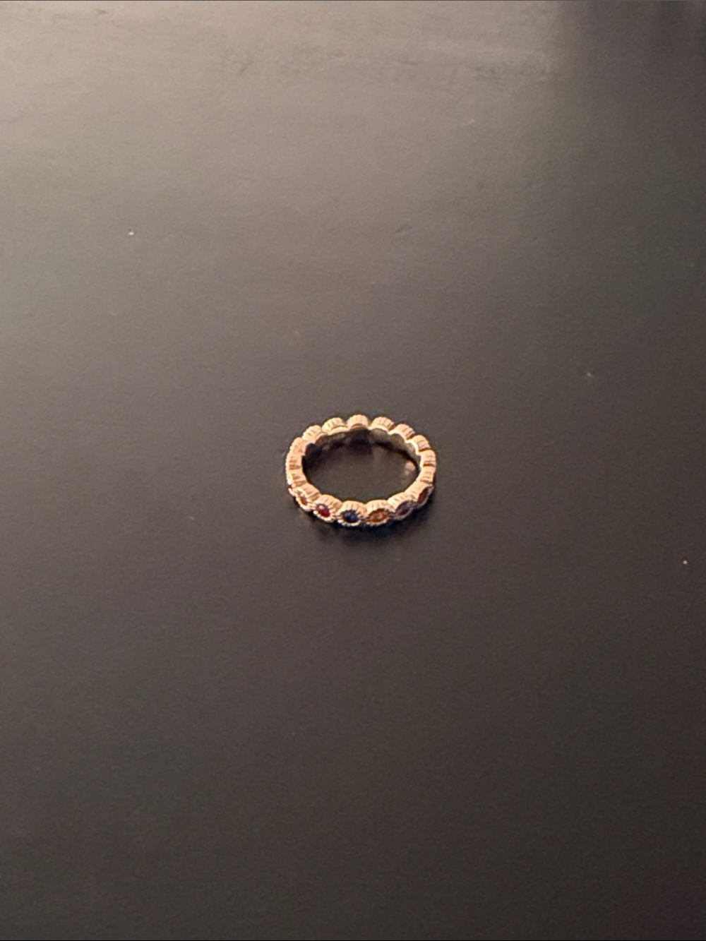 Delicate Rose Gold Eternity Ring with Multicolored Gem Accents